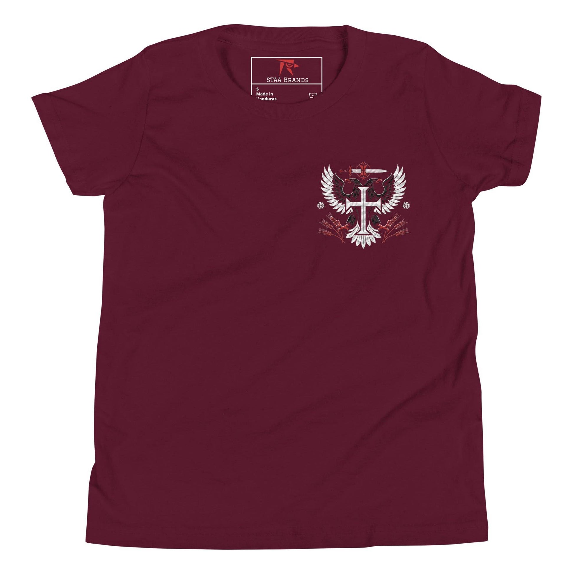 a maroon t - shirt with the emblem of a cross